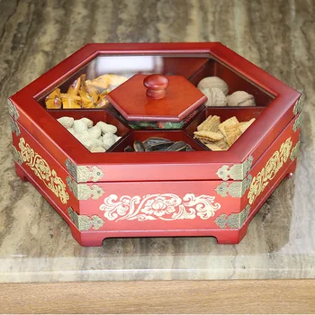 Креативната кутия за сушени плодове в китайската хол от масивна дървесина с разделен на кабинета с капак, чиния за бонбони от семената на пъпеш, чиния за закуски с плодове